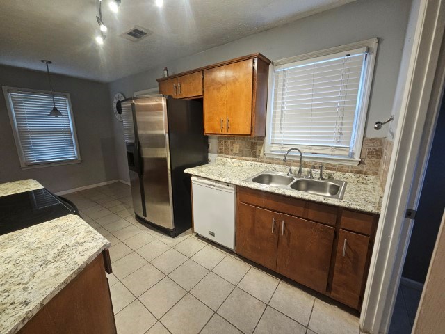1804 Dallas Court Columbus, GA 31907 - Photo 15 of 50 a kitchen with stainless steel appliances granite countertop a sink stove and refrigerator