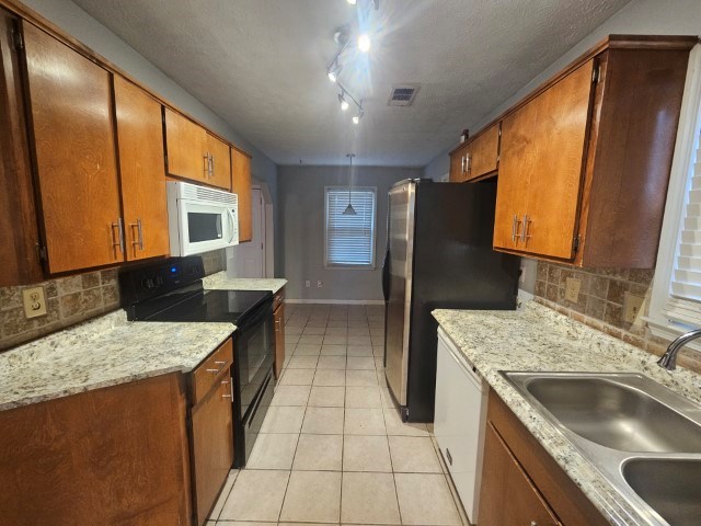 1804 Dallas Court Columbus, GA 31907 - Photo 19 of 50 a kitchen with a sink stove and refrigerator