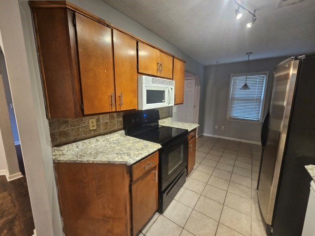 1804 Dallas Court Columbus, GA 31907 - Photo 20 of 50 a kitchen with stainless steel appliances granite countertop a sink stove and refrigerator
