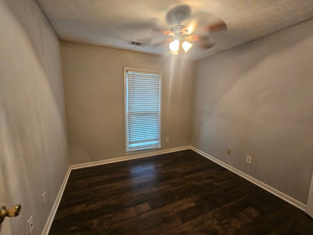 1804 Dallas Court Columbus, GA 31907 - Photo 34 of 50 a view of an empty room with wooden floor and a window