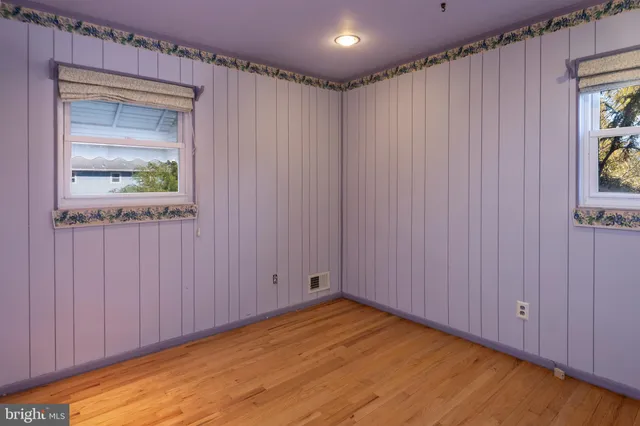 a view of an empty room and a window