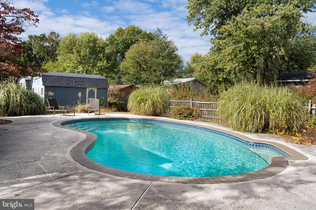 a view of a swimming pool with a patio