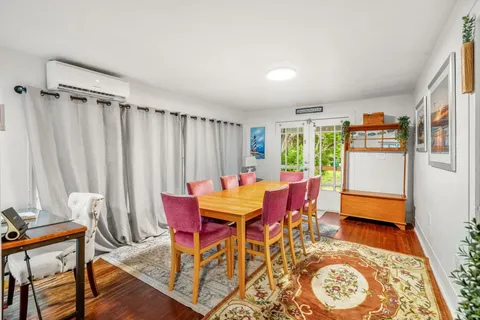 a living room with furniture and a rug