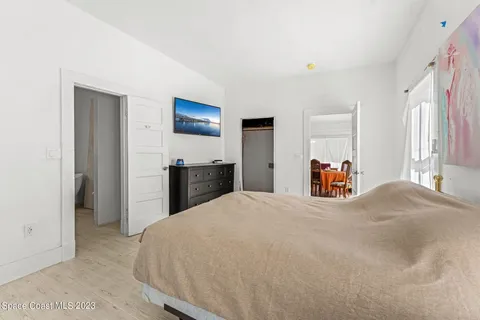 a bedroom with a bed and a dresser