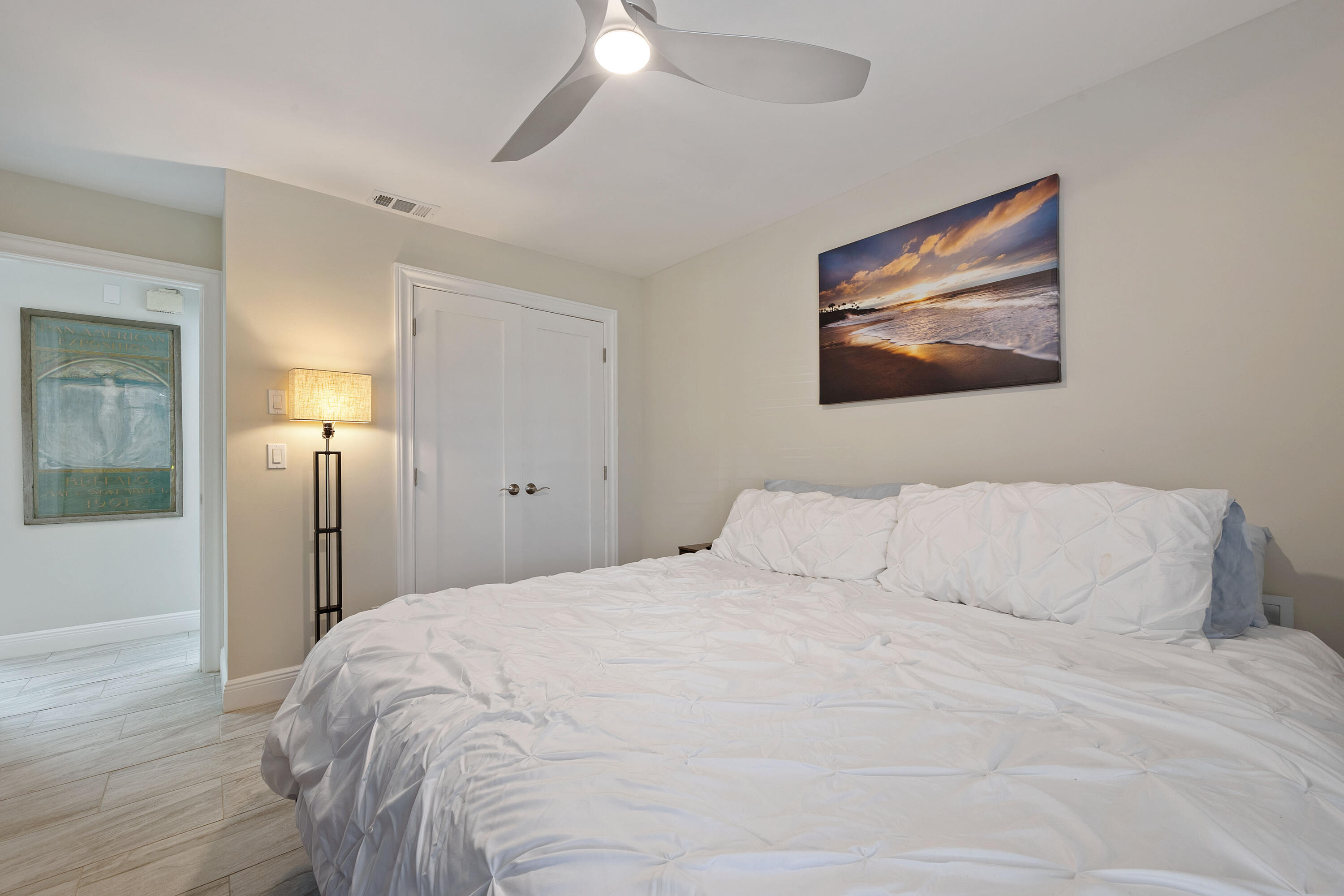 7 Ridge Pointe Drive, Unit C Boynton Beach, FL 33435 - Photo 20 of 29 a bedroom with a bed and a painting