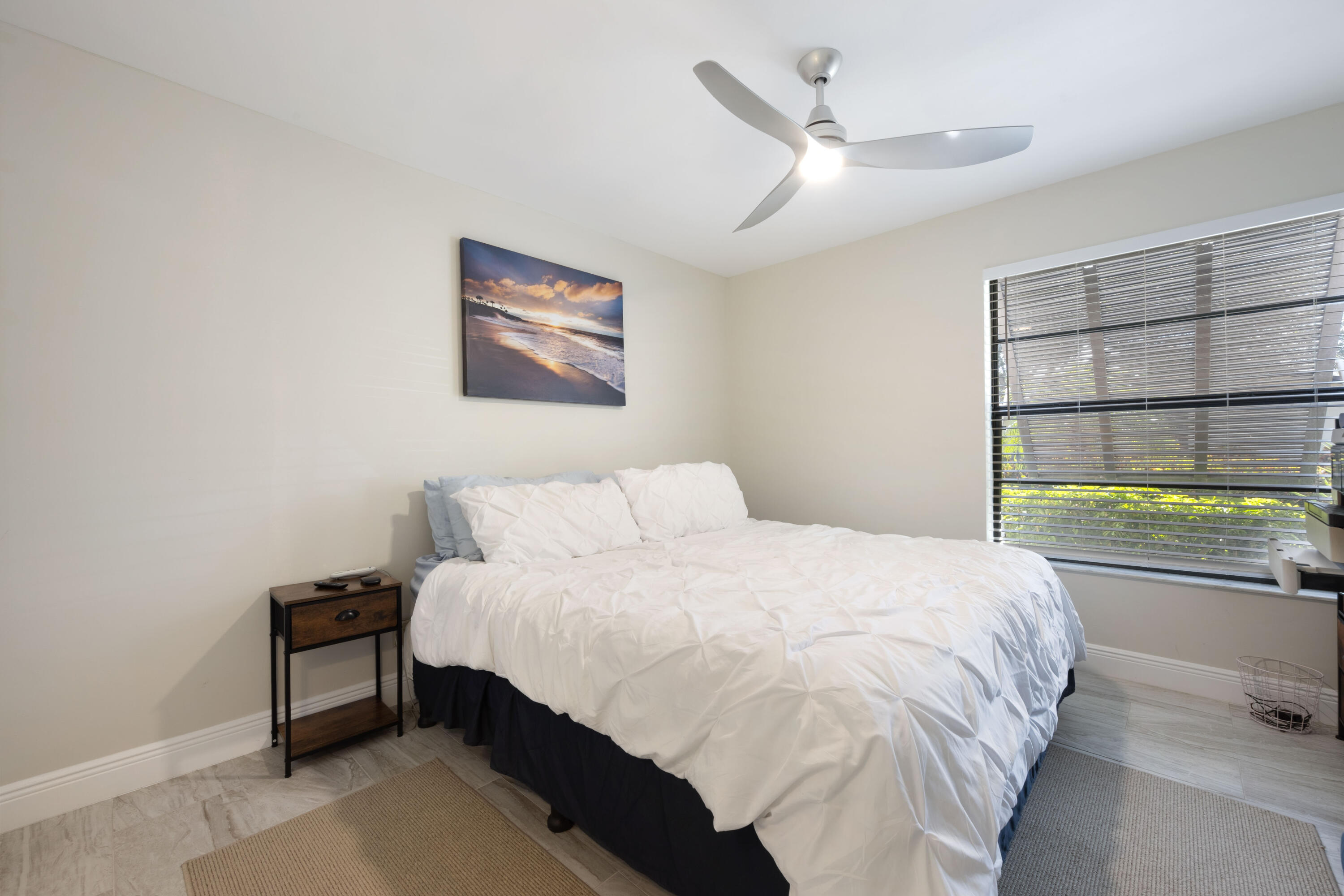 7 Ridge Pointe Drive, Unit C Boynton Beach, FL 33435 - Photo 21 of 29 a bedroom with a bed and a window