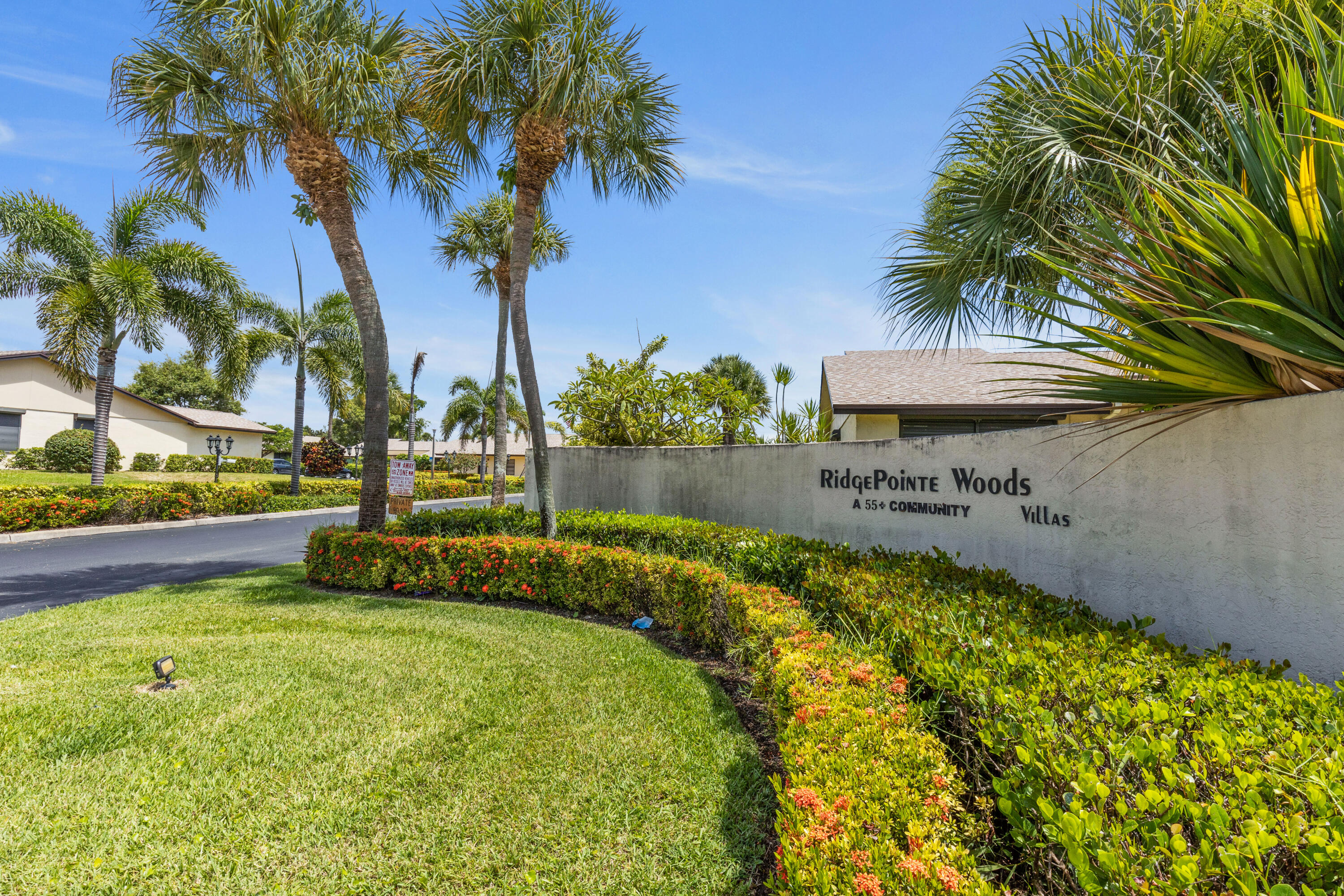 7 Ridge Pointe Drive, Unit C Boynton Beach, FL 33435 - Photo 25 of 29 a view of swimming pool with a garden