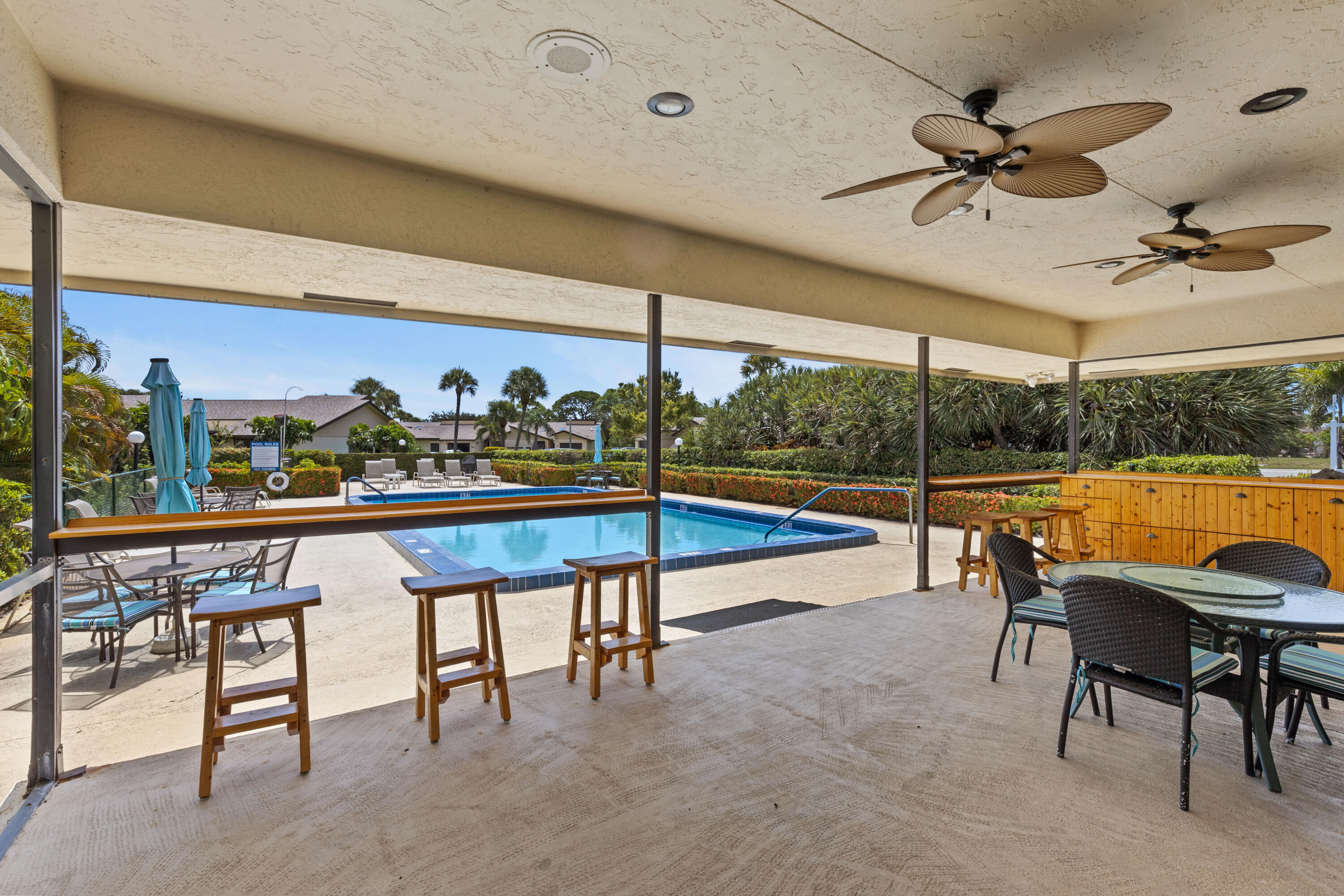 7 Ridge Pointe Drive, Unit C Boynton Beach, FL 33435 - Photo 27 of 29 a view of a dining room with furniture window and outside view