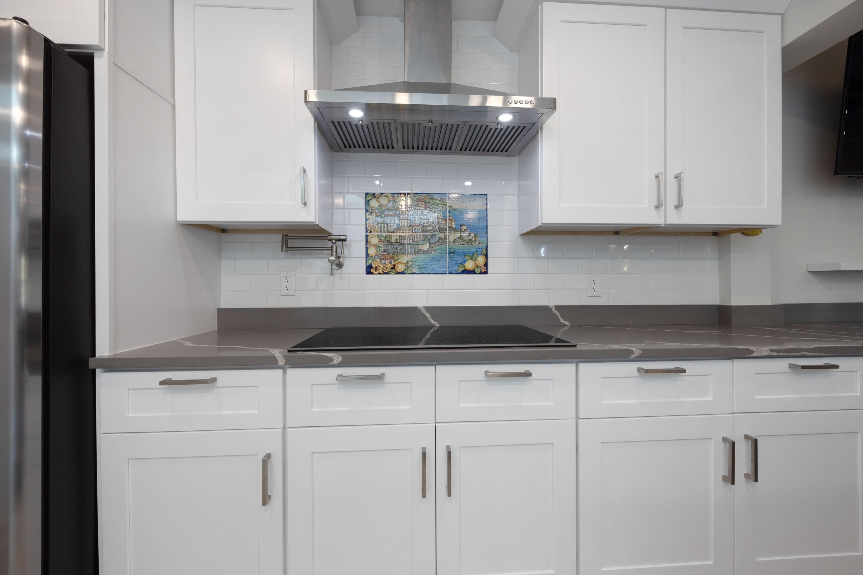 7 Ridge Pointe Drive, Unit C Boynton Beach, FL 33435 - Photo 5 of 29 a stove top oven sitting inside of a kitchen