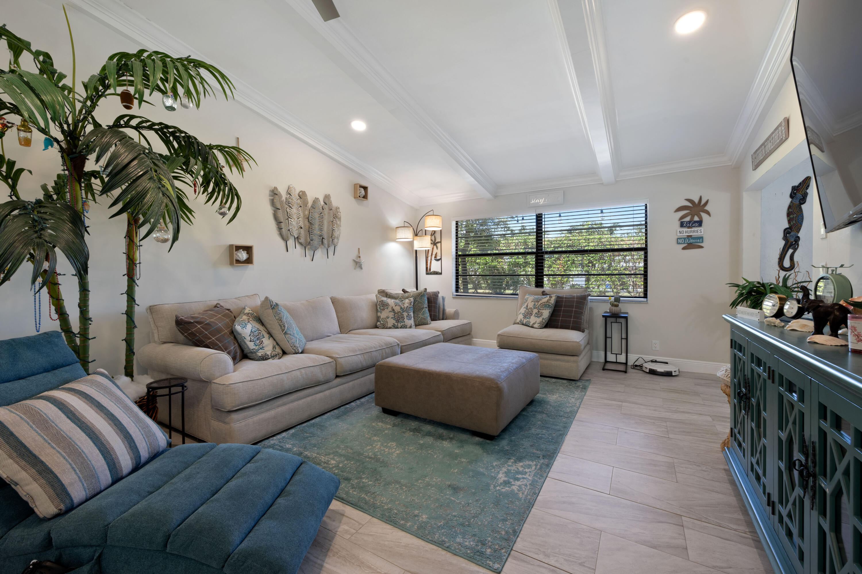 7 Ridge Pointe Drive, Unit C Boynton Beach, FL 33435 - Photo 9 of 29 a living room with furniture and a potted plant