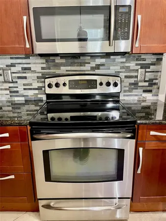 a kitchen with a stove and a cabinet