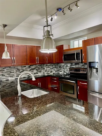 a view of a refrigerator in kitchen