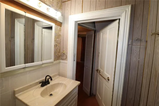 a bathroom with a sink and mirror