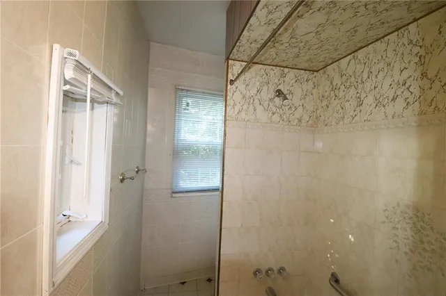 a bathroom with a glass shower door
