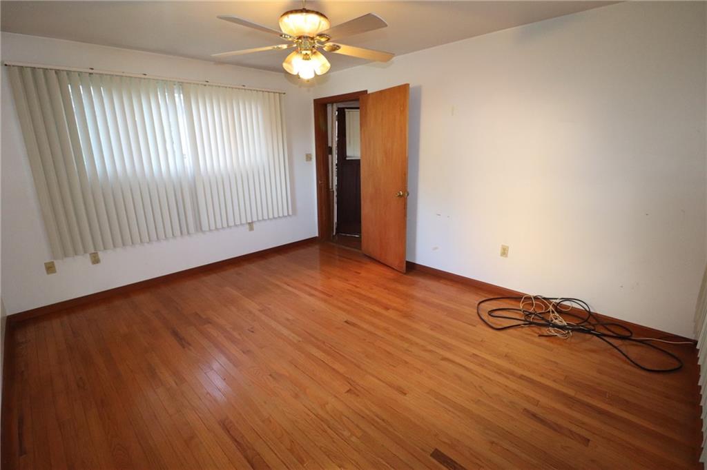 3397 Ridgway Street Pittsburgh, PA 15213 - Photo 19 of 33 an empty room with wooden floor and windows