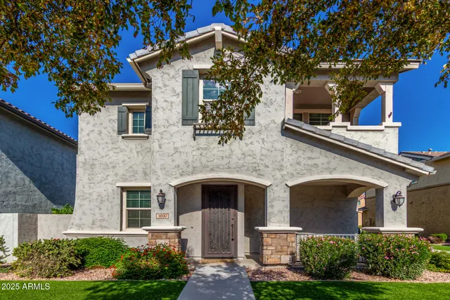 front view of a house with a tree