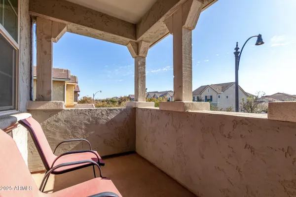 a view of balcony with furniture