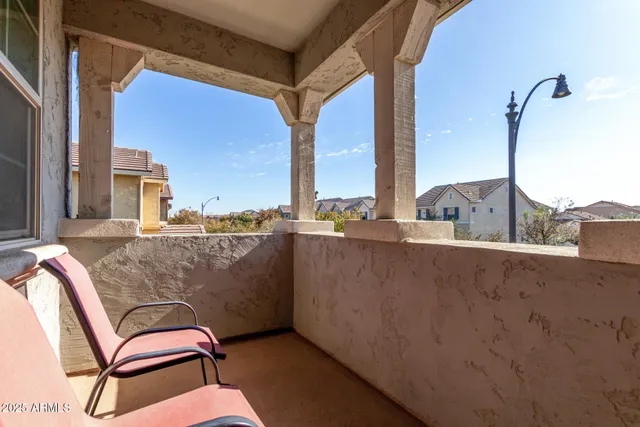 a view of balcony with furniture