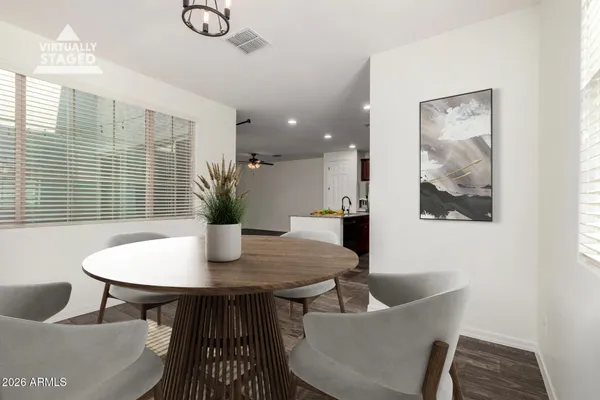 a view of a dining room with furniture and wooden floor