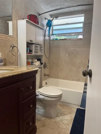 a bathroom with a sink a toilet and a bathtub