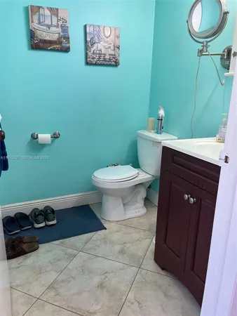 a bathroom with a toilet and a sink