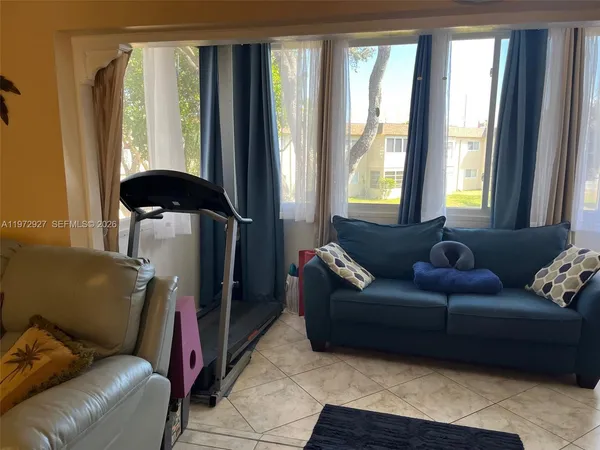 a living room with furniture and a window