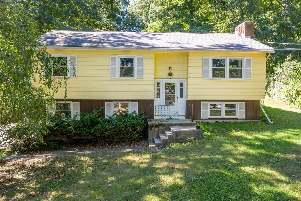 717 Florence Road Northampton, MA 01062 - Photo 1 of 27 a view of a house with a yard plants and large tree