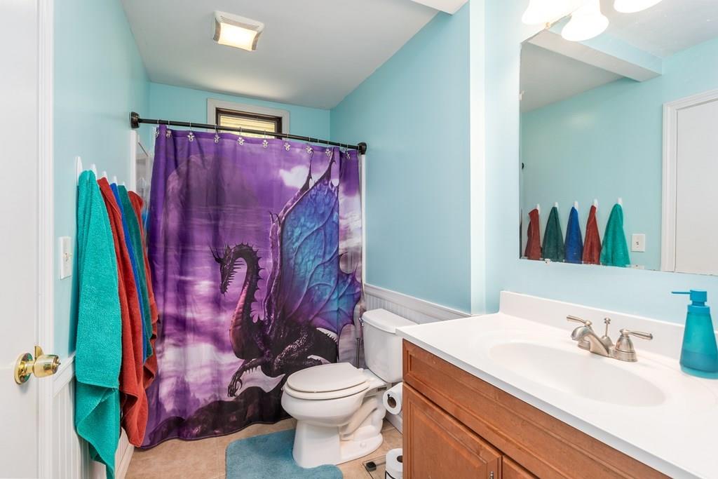 717 Florence Road Northampton, MA 01062 - Photo 11 of 27 a bathroom with a toilet sink and mirror