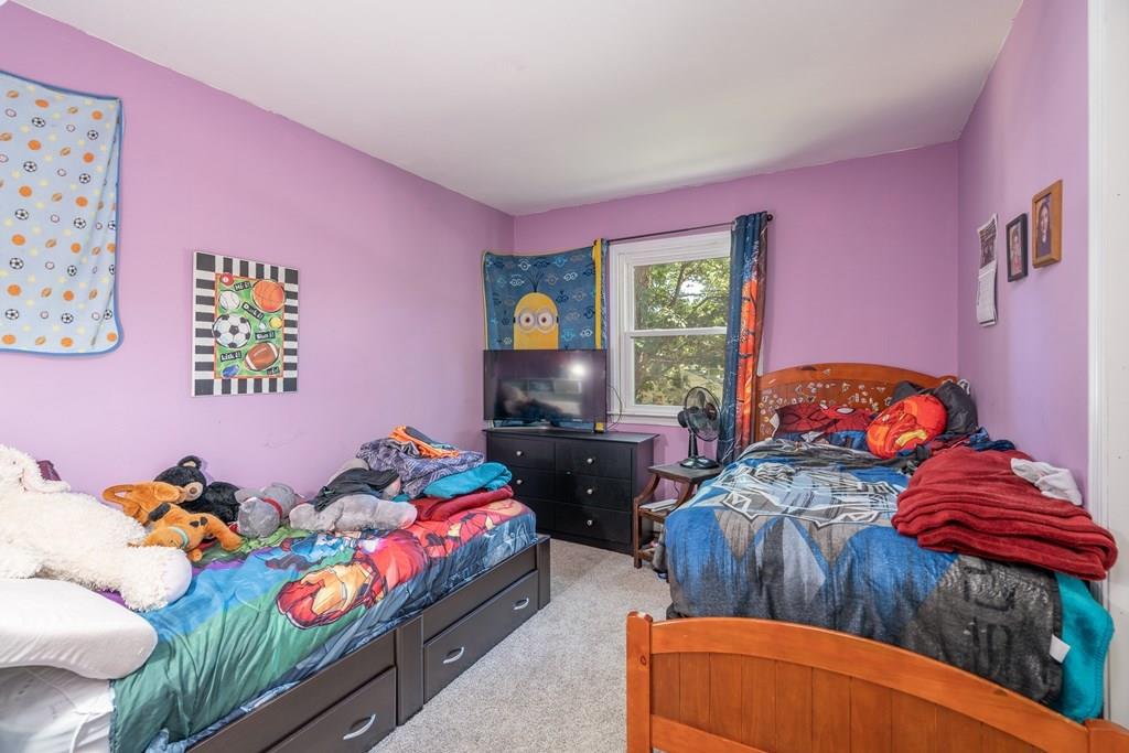 717 Florence Road Northampton, MA 01062 - Photo 13 of 27 a bedroom with furniture and a window