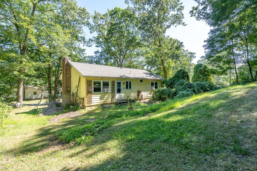717 Florence Road Northampton, MA 01062 - Photo 26 of 27 a front view of a house with a garden