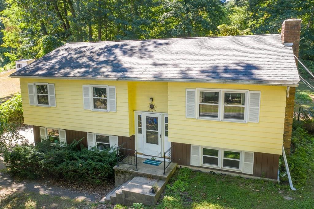717 Florence Road Northampton, MA 01062 - Photo 4 of 27 a view of house with backyard garden and outdoor seating