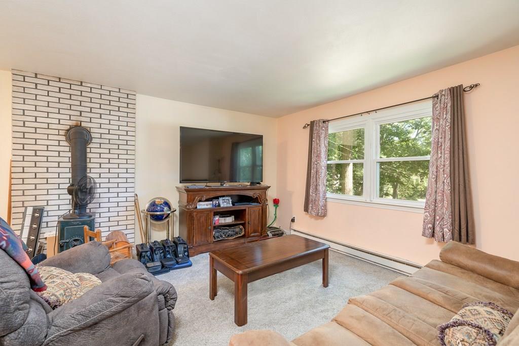 717 Florence Road Northampton, MA 01062 - Photo 9 of 27 a living room with furniture and a flat screen tv