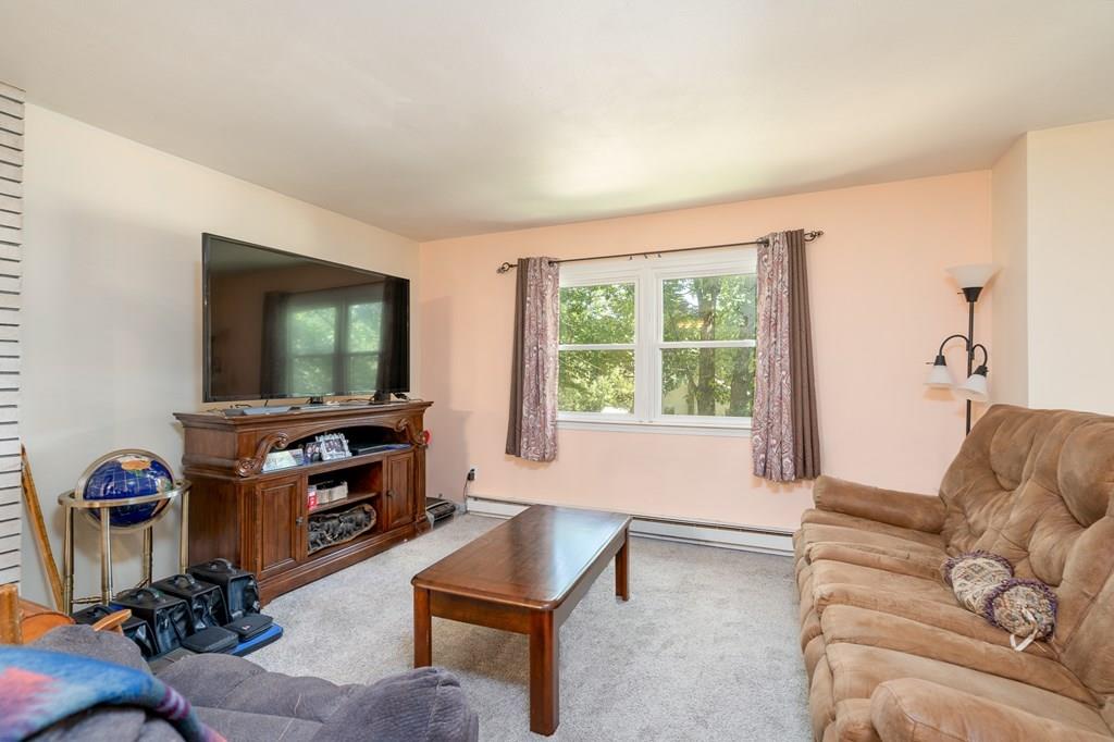 717 Florence Road Northampton, MA 01062 - Photo 10 of 27 a living room with furniture and a flat screen tv