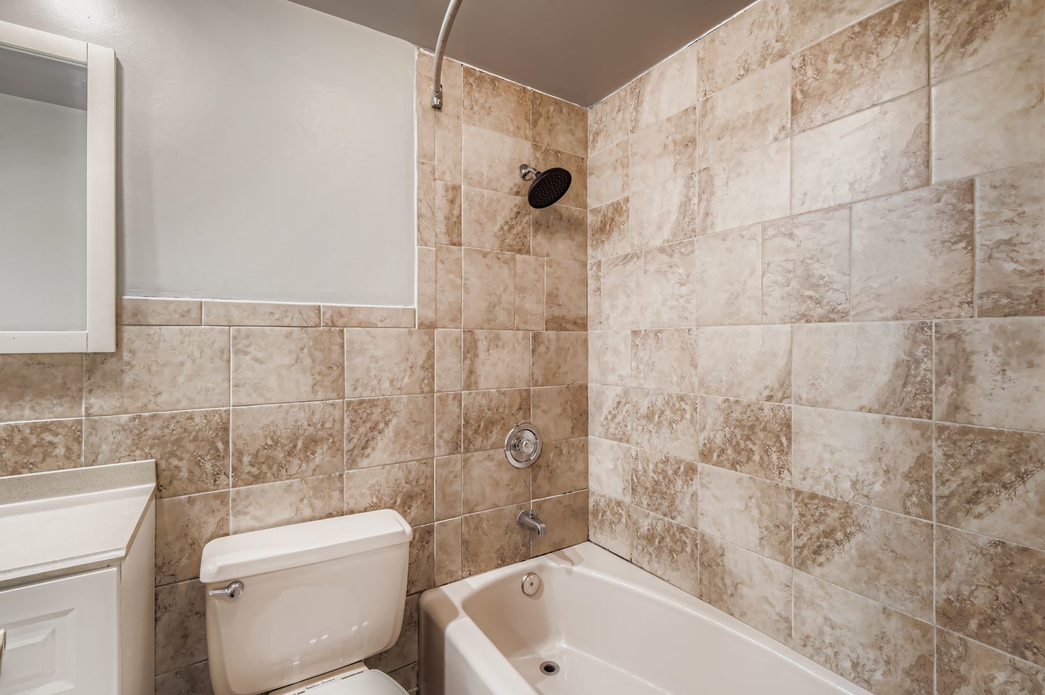 10048 South Pulaski Road, Unit 1E Oak Lawn, IL 60453 - Photo 13 of 27 a bathroom with a toilet and a bathtub