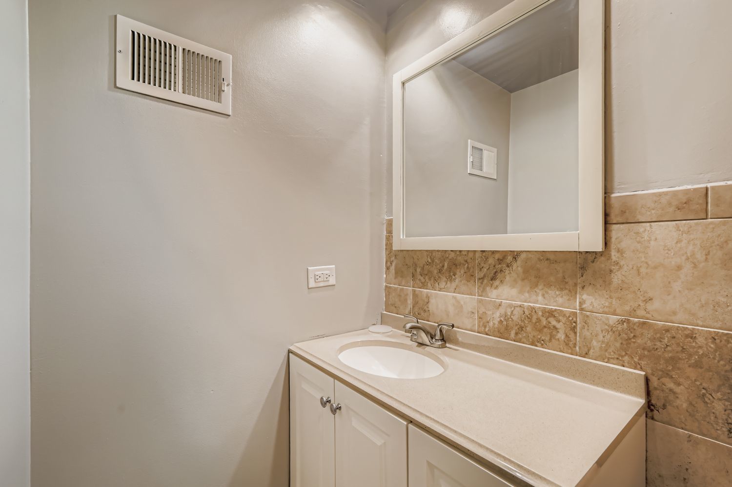 10048 South Pulaski Road, Unit 1E Oak Lawn, IL 60453 - Photo 19 of 27 a bathroom with a sink and a mirror