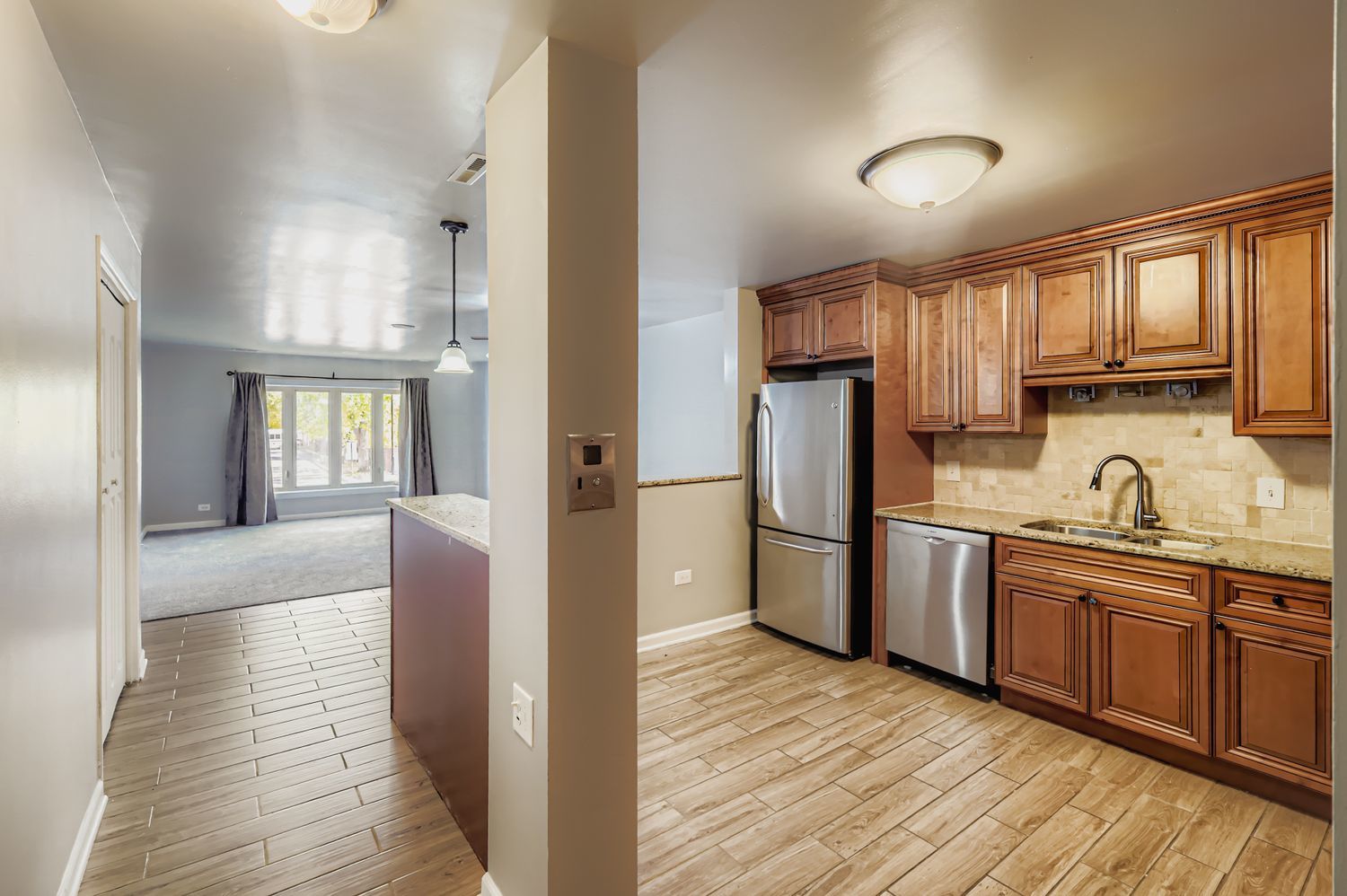 10048 South Pulaski Road, Unit 1E Oak Lawn, IL 60453 - Photo 2 of 27 a kitchen with stainless steel appliances granite countertop a refrigerator sink and cabinets