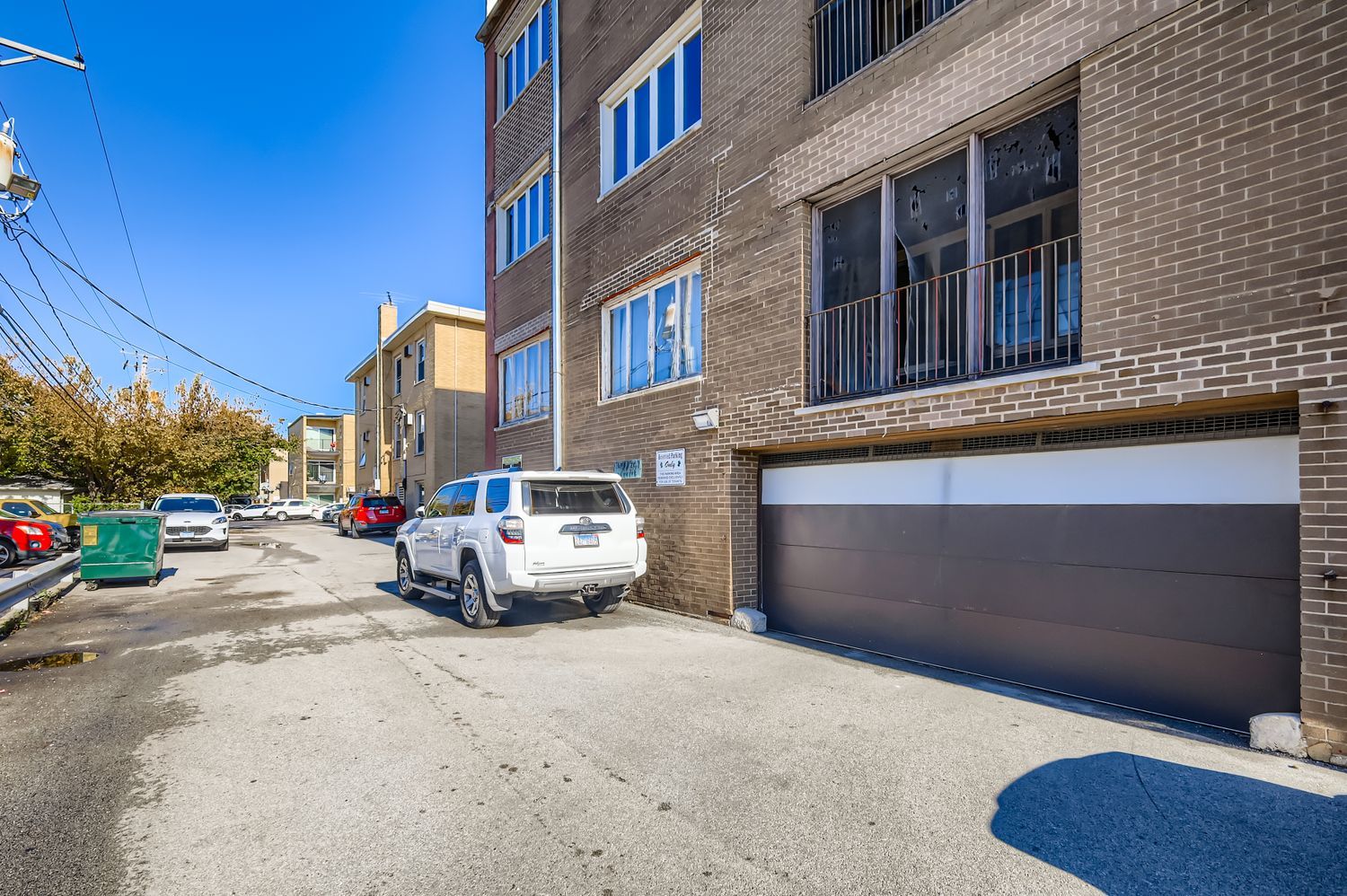 10048 South Pulaski Road, Unit 1E Oak Lawn, IL 60453 - Photo 27 of 27 a car parked on the side of a street