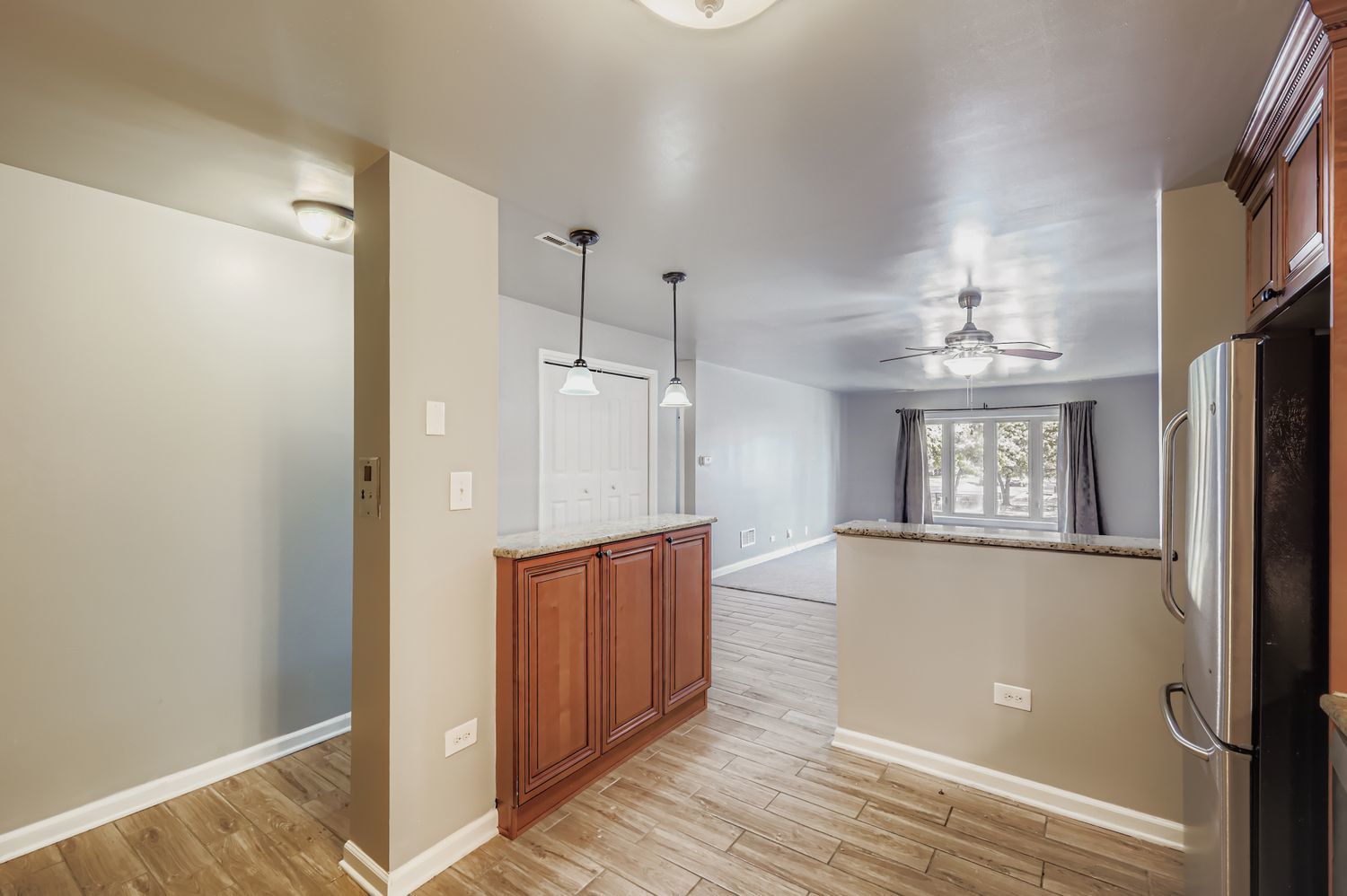 10048 South Pulaski Road, Unit 1E Oak Lawn, IL 60453 - Photo 4 of 27 a view of a hallway with wooden floor and staircase