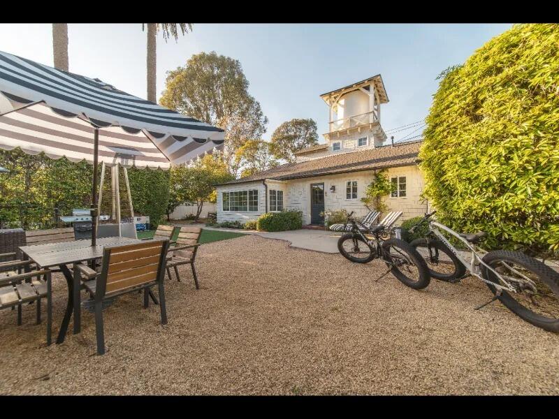 70 Eucalyptus Lane Santa Barbara, CA 93108 - Photo 1 of 47 a view of a patio with table and chairs and potted plants