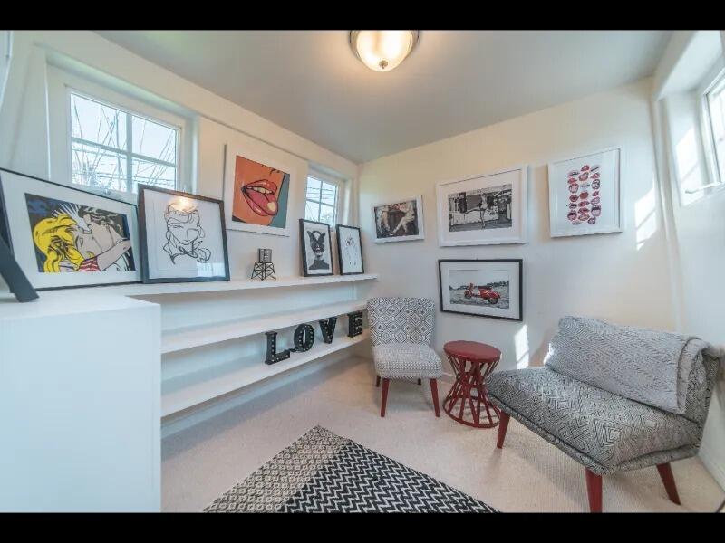 70 Eucalyptus Lane Santa Barbara, CA 93108 - Photo 42 of 47 a living room with furniture and paintings on the wall