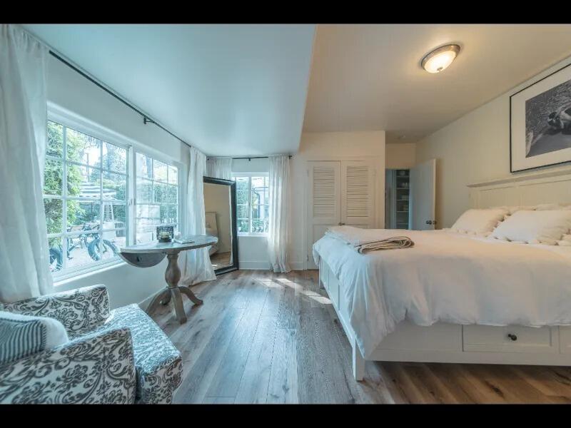 70 Eucalyptus Lane Santa Barbara, CA 93108 - Photo 5 of 47 a spacious bedroom with a bed and large windows