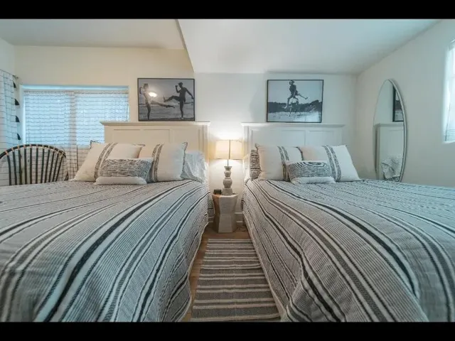 a bedroom with double bed and a night stand