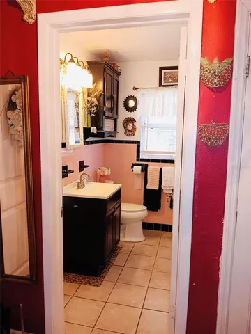 a reading room with furniture and rug