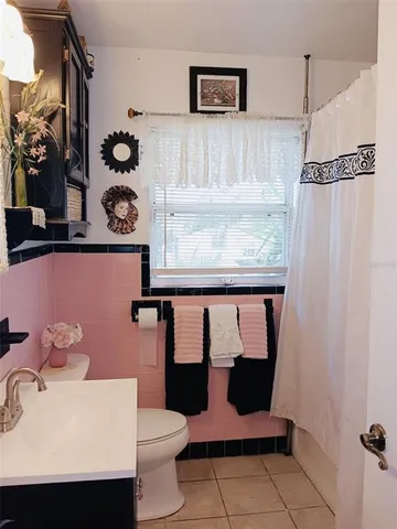 a kitchen with stainless steel appliances a stove a sink and a refrigerator