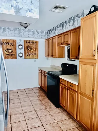 a living room with hard wood flooring and a couch
