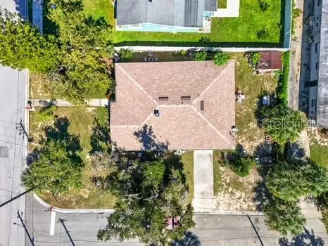 a view of house with a yard