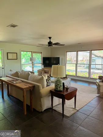 a living room with furniture and a large window
