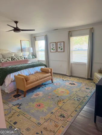 a living room with a couch and a rug