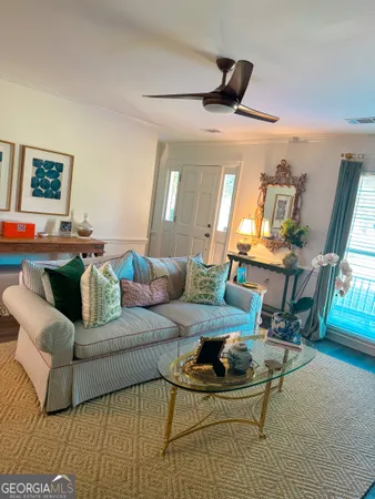 a living room with furniture and a rug