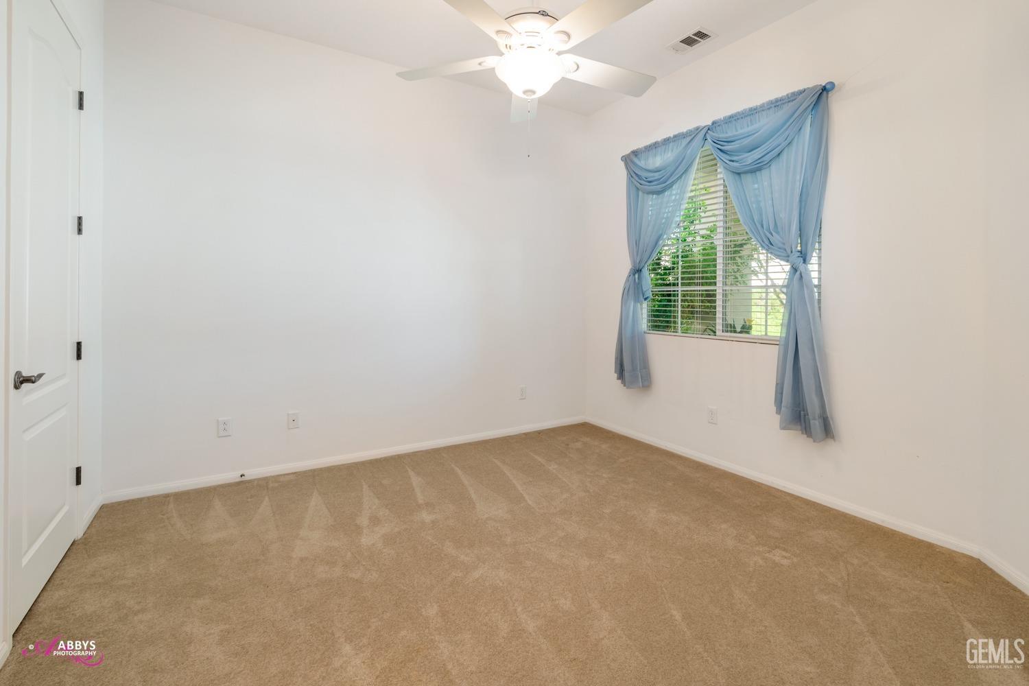 Undisclosed Address Bakersfield, CA 93306 - Photo 15 of 51 a view of an empty room with a window